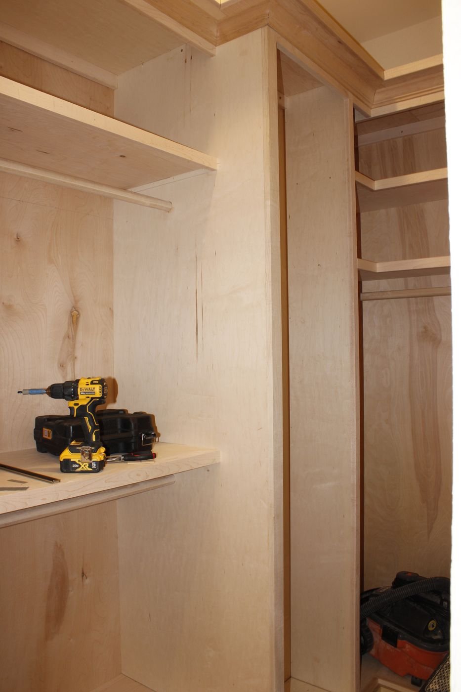 Custom closet built-in cabinetry under construction