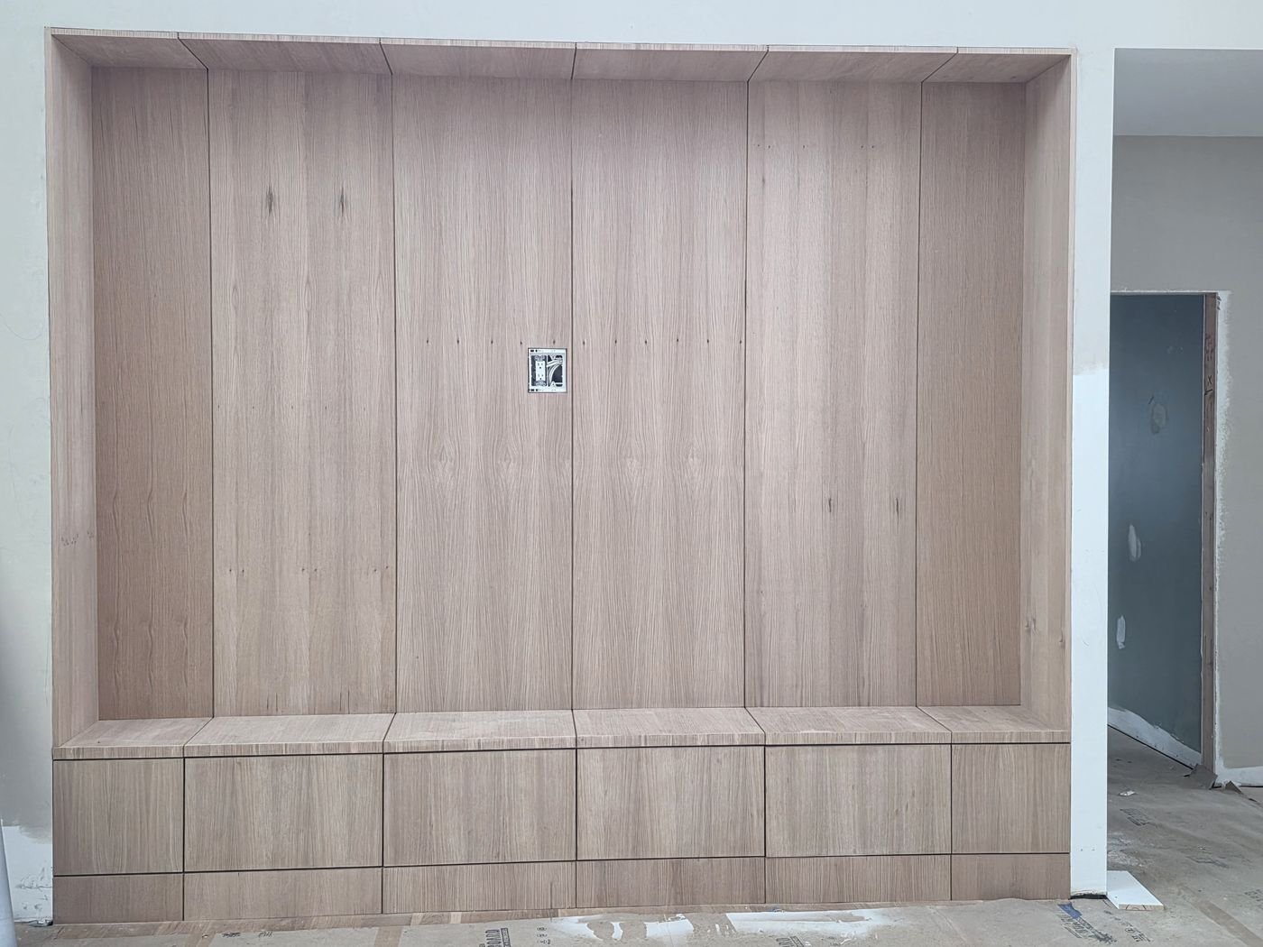 Built-in entertainment cabinetry with clean paneled doors