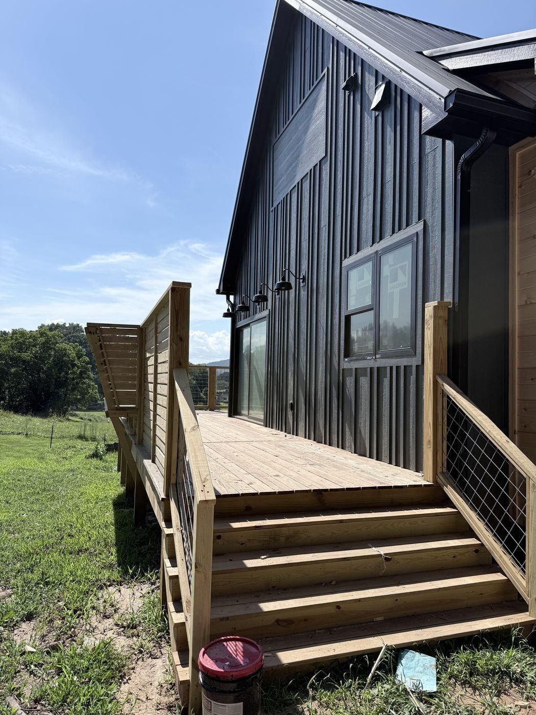 Wood deck and steps leading to a home entrance