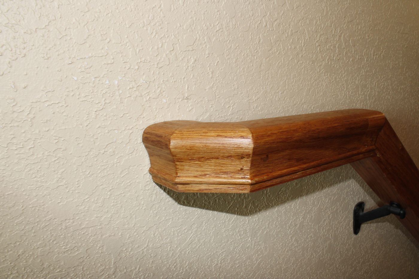 Wood stair handrail end detail