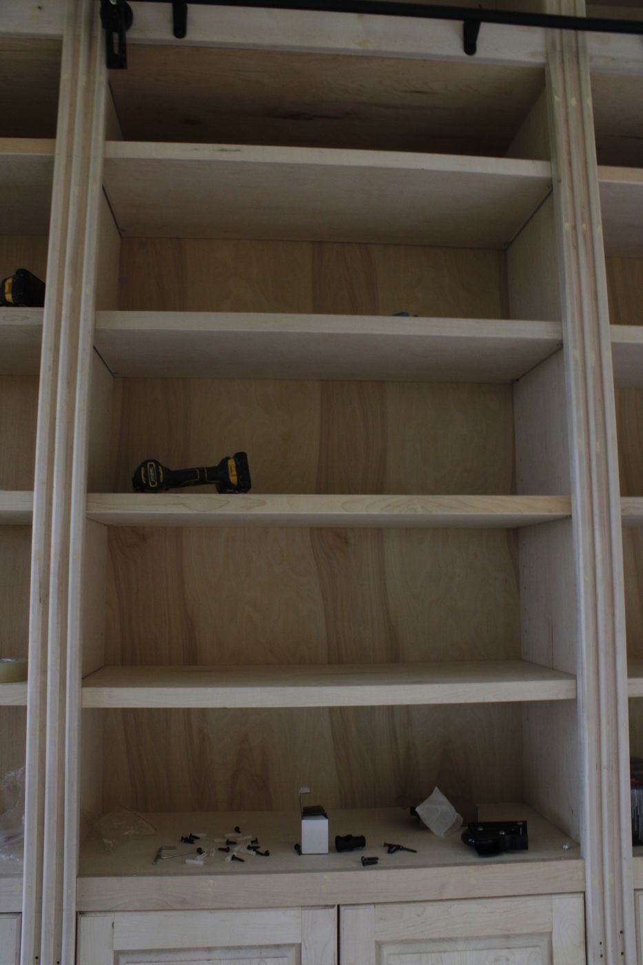 Built-in library shelving detail, unfinished wood