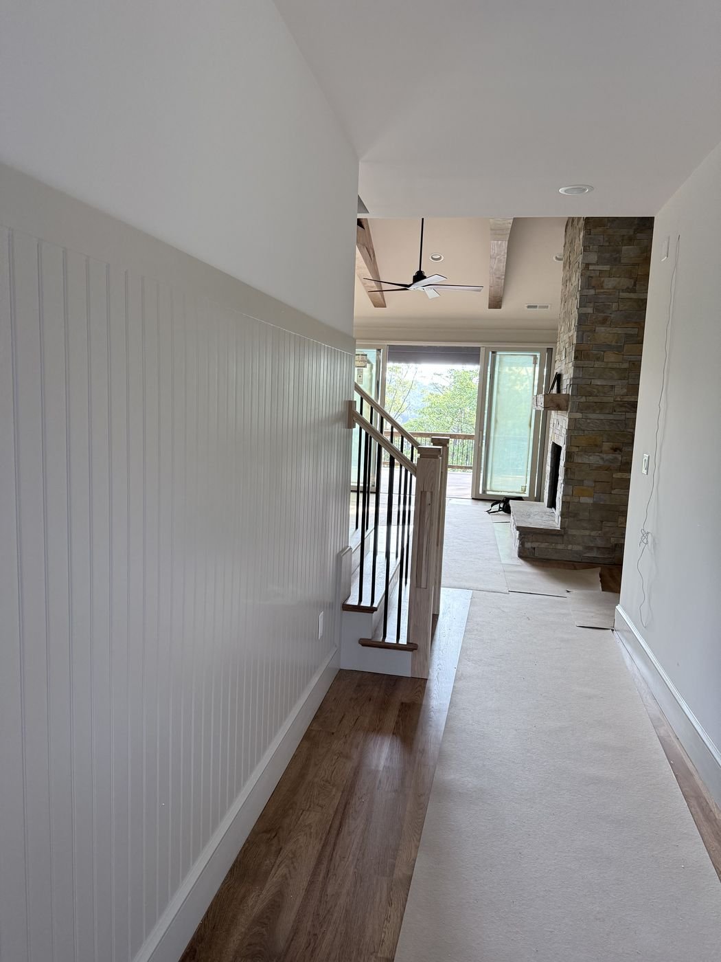 Beadboard wainscoting along a hallway wall